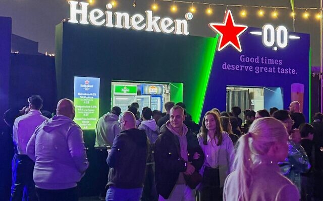 Festivalgoers gather near food and beverage stands, including a booth serving nonalcoholic beer, during the Soundstorm music festival in Riyadh, Saudi Arabia, December 11, 2025. (AP/Baraa Anwer) Festivalgoers gather near food and beverage stands, including a booth serving nonalcoholic beer, during the Soundstorm music festival in Riyadh, Saudi Arabia, December 11, 2025. (AP/Baraa Anwer)