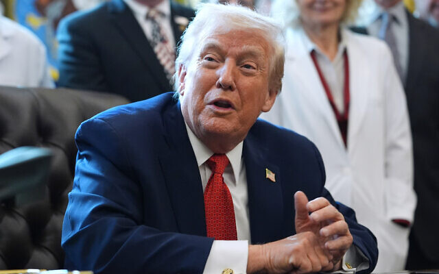 US President Donald Trump speaks to reporters after signing an executive order in the Oval Office of the White House, December 18, 2025, in Washington. (AP/Evan Vucci) US President Donald Trump speaks to reporters after signing an executive order in the Oval Office of the White House, December 18, 2025, in Washington. (AP/Evan Vucci)