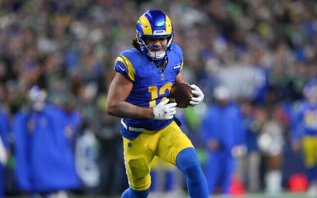 Los Angeles Rams wide receiver Puka Nacua runs for a touchdown during overtime in an NFL football game against the Seattle Seahawks, December 18, 2025, in Seattle. (AP Photo/Lindsey Wasson) Los Angeles Rams wide receiver Puka Nacua runs for a touchdown during overtime in an NFL football game against the Seattle Seahawks, December 18, 2025, in Seattle. (AP Photo/Lindsey Wasson)
