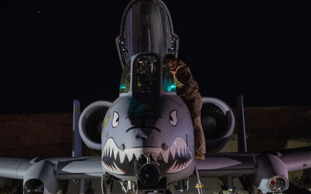 A US Airman prepares an A-10 Thunderbolt II for flight from a base in the US Central Command area of responsibility, December 19, 2025, in support of Operation Hawkeye Strike against Islamic State targets in Syria. (US Air Force/DVIDS via AP)