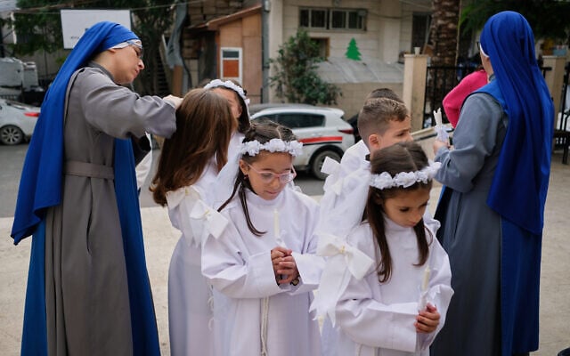 Children and nuns gather outside the Holy Family Catholic Church before attending a mass ahead of Christmas celebrations in Gaza City, December 21, 2025. (AP/Jehad Alshrafi) Children and nuns gather outside the Holy Family Catholic Church before attending a mass ahead of Christmas celebrations in Gaza City, December 21, 2025. (AP/Jehad Alshrafi)