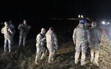 Turkish soldiers and rescue teams search for the remains of a private jet carrying Libya's military chief and four others that crashed after taking off from Ankara, killing everyone on board, in Ankara, Turkey, December 23, 2025. (AP/Efekan Akyuz)