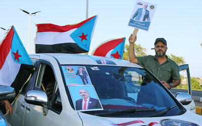 Supporters of the Southern Transitional Council (STC), a coalition of separatist groups seeking to restore the state of South Yemen, hold South Yemen flags and a poster of their leader, Aidarous al-Zubaidi during a rally, in Aden, Yemen, December 25, 2025. (AP)