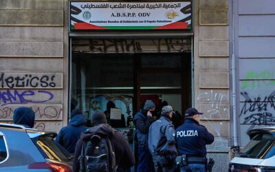Police officers inspect a pro-Palestinian charity implicated in the alleged transfer of millions of euros to Hamas, Milan, Italy, December 27, 2025. (Claudio Furlan/LaPresse via AP)