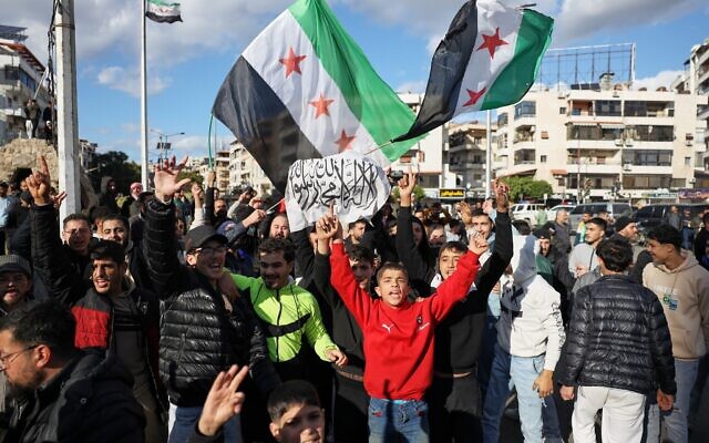 Counterprotesters chant pro-government slogans at Alawite demonstrators, two days after a bomb in an Alawite mosque in Homs killed eight people and wounded 18 during Friday prayers, in Latakia, Syria's coastal region, December 28, 2025. (AP/Omar Albam) Counterprotesters chant pro-government slogans at Alawite demonstrators, two days after a bomb in an Alawite mosque in Homs killed eight people and wounded 18 during Friday prayers, in Latakia, Syria's coastal region, December 28, 2025. (AP/Omar Albam)