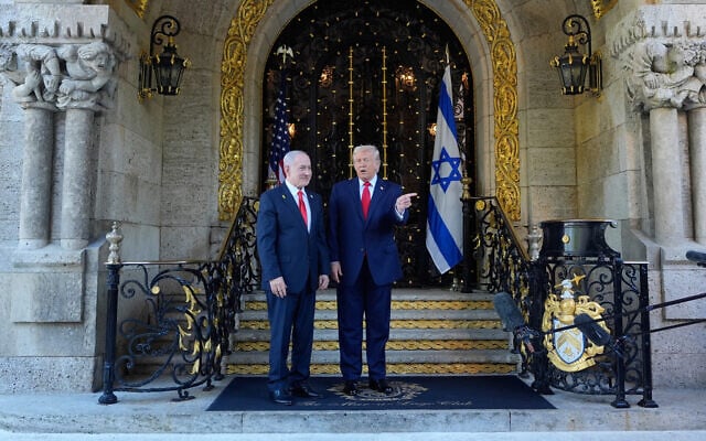 US President Donald Trump greets Prime Minister Benjamin Netanyahu at Trump's Mar-a-Lago club, December 29, 2025, in Palm Beach, Florida. (AP/Alex Brandon)