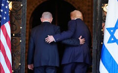 US President Donald Trump (right) and Prime Minister Benjamin Netanyahu walk into Trump's Mar-a-Lago club, December 29, 2025, in Palm Beach, Florida. (AP/Alex Brandon)