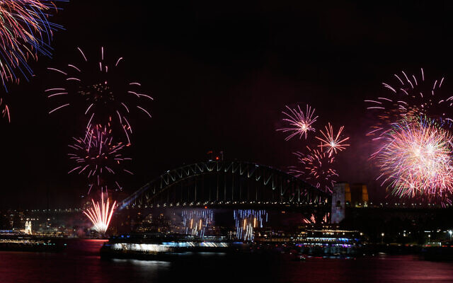 Fireworks burst over the Sydney Harbour Bridge as New Year's celebrations begin in Sydney, December 31, 2025. (AP/Rick Rycroft)