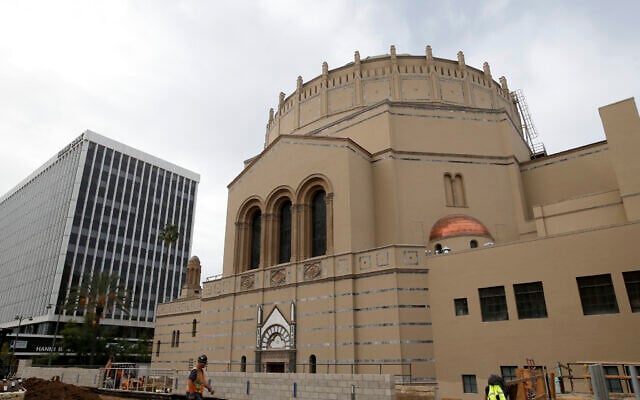 In this Jan. 23, 2013, photo, a construction worker walks past Wilshire Boulevard Temple in Los Angeles. (AP Photo/Jae C. Hong) In this Jan. 23, 2013, photo, a construction worker walks past Wilshire Boulevard Temple in Los Angeles. (AP Photo/Jae C. Hong)