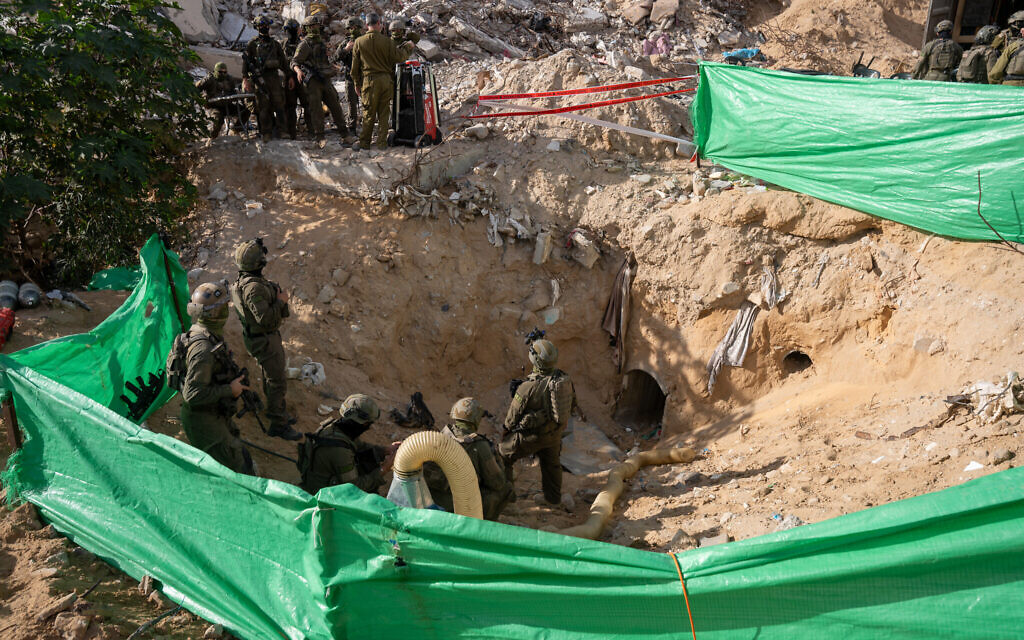 IDF soldiers stand near the entrance to a tunnel in the Rafah area of the southern Gaza Strip, where the body of Lt. Hadar Goldin was held, December 8, 2025. (Emanuel Fabian/Times of Israel)