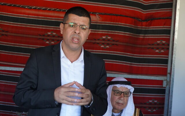 Ra'am MK Waleed Alhawashleh speaks to reporters in Tarabin al-Sana, a Bedouin village subject to a days-long raid by police, on December 31, 2025. (Charlie Summers/Times of Israel)