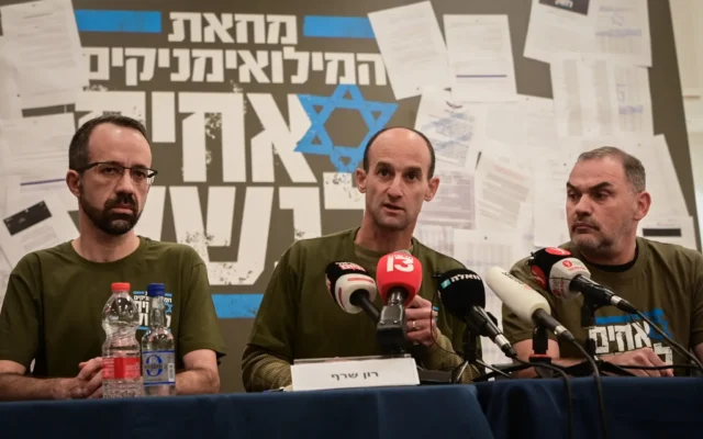 Col. (res.) German Giltman (right) is seen with other members of the 'Brothers in Arms' reservist protest group, during a press conference in Tel Aviv, March 21, 2023. (Avshalom Sassoni/Flash90) Col. (res.) German Giltman (right) is seen with other members of the 'Brothers in Arms' reservist protest group, during a press conference in Tel Aviv, March 21, 2023. (Avshalom Sassoni/Flash90)