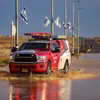 FILE: Authorities block Route90 in the Negev Desert, after it was flooded due to heavy rains, May 4, 2025. (David Cohen/Flash90)