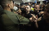 Freed hostage Elkana Bohbot arrives at his home near Jerusalem on October 19, 2025. (Yonatan Sindel/Flash90)