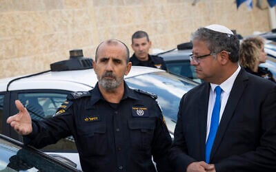 National Security Minister Itamar Ben Gvir (right) and police chief Danny Levy attend a ceremony at the Israel Police headquarters in Jerusalem, November 30, 2025. (Chaim Goldberg/Flash90)
