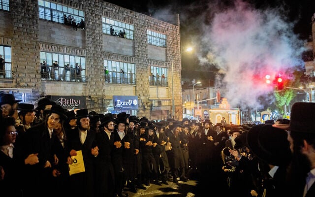 Ultra-Orthodox Jews take part in a parade for marking the release of a draft dodger who was released from military prison, November 30, 2025. (Chaim Goldberg/Flash90) Ultra-Orthodox Jews take part in a parade for marking the release of a draft dodger who was released from military prison, November 30, 2025. (Chaim Goldberg/Flash90)