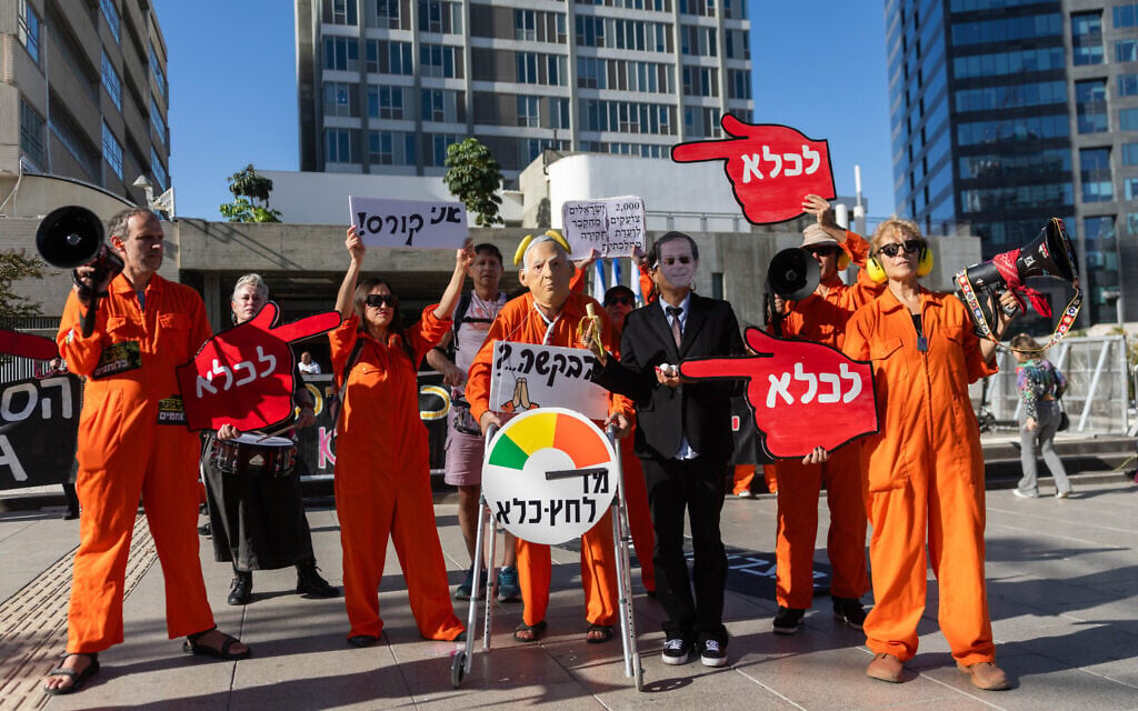 Activists protest outside a court hearing in the trial of Prime Minister Benjamin Netanyahu in Tel Aviv, calling not to grant him a pardon, December 1, 2025. (Chaim Goldberg/Flash90) Activists protest outside a court hearing in the trial of Prime Minister Benjamin Netanyahu in Tel Aviv, calling not to grant him a pardon, December 1, 2025. (Chaim Goldberg/Flash90)