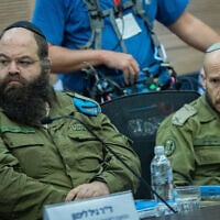 Brig. Gen. Shay Tayeb, head of the IDF Personnel Directorate's Planning and Personnel Management Division (right), speaks at a Knesset Foreign Affairs and Defense Committee meeting, December 2, 2025. (Yonatan Sindel/Flash90)