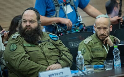 Brig. Gen. Shay Tayeb, head of the IDF Personnel Directorate's Planning and Personnel Management Division (right), speaks at a Knesset Foreign Affairs and Defense Committee meeting, December 2, 2025. (Yonatan Sindel/Flash90)
