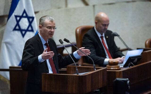 Justice Minister Yariv Levin speaks from the Knesset podium, December 3, 2025. (Yonatan Sindel/Flash90) Justice Minister Yariv Levin speaks from the Knesset podium, December 3, 2025. (Yonatan Sindel/Flash90)