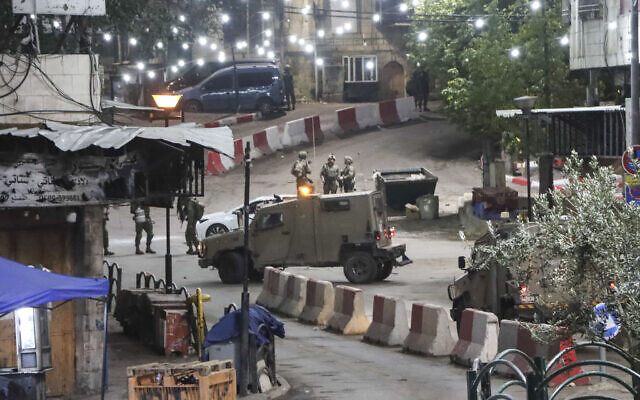 Israeli security forces near the site of a car ramming attack, in the West Bank city of Hebron, December 6, 2025. (Wisam Hashlamoun/Flash90) Israeli security forces near the site of a car ramming attack, in the West Bank city of Hebron, December 6, 2025. (Wisam Hashlamoun/Flash90)