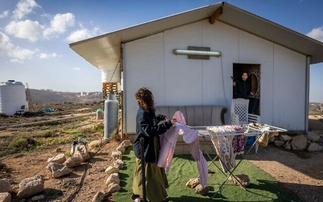Jewish settlers seen at an illegal outpost in the Binyamin area of the central West Bank, December 7, 2025. (Chaim Goldberg/Flash90) Jewish settlers seen at an illegal outpost in the Binyamin area of the central West Bank, December 7, 2025. (Chaim Goldberg/Flash90)