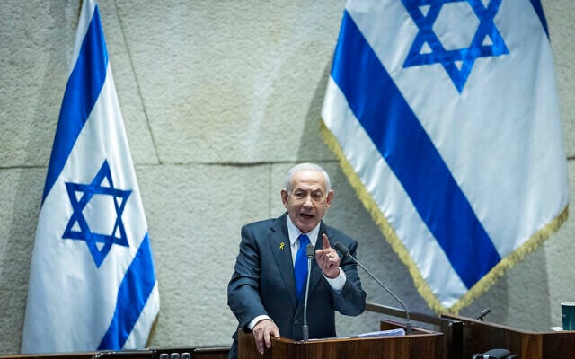 Israeli Prime Minister Benjamin Netanyahu at a 40 signatures debate, at the plenum hall of the Knesset, December 8, 2025. (Chaim Goldberg/Flash90)