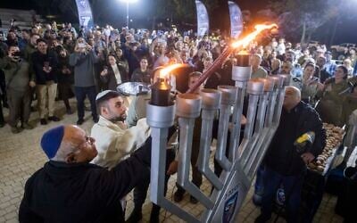 Former hostage Matan Angrest attends a ceremony marking the first night of Hanukkah at the National Library in Jerusalem, December 14, 2025. (Chaim Goldberg/Flash90)
