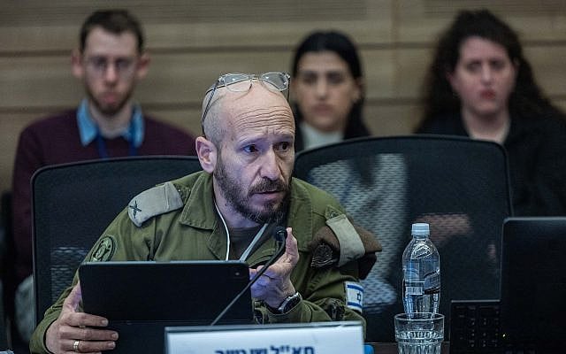 Brig. Gen. Shay Tayeb, head of the IDF Personnel Directorate's Planning and Personnel Management Division, addresses the Knesset Foreign Affairs and Defense Committee, December 14, 2025. (Yonatan Sindel/Flash90) Brig. Gen. Shay Tayeb, head of the IDF Personnel Directorate's Planning and Personnel Management Division, addresses the Knesset Foreign Affairs and Defense Committee, December 14, 2025. (Yonatan Sindel/Flash90)
