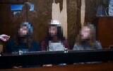 Three Jewish suspects, accused of assaulting a pregnant Arab woman in Jaffa several days earlier, arrive for a hearing on the extension of their detention at the Tel Aviv Magistrate’s Court on December 16, 2025. (Avshalom Sassoni/Flash90)
