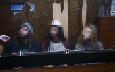 Three Jewish suspects, accused of assaulting a pregnant Arab woman in Jaffa several days earlier, arrive for a hearing on the extension of their detention at the Tel Aviv Magistrate’s Court on December 16, 2025. (Avshalom Sassoni/Flash90)