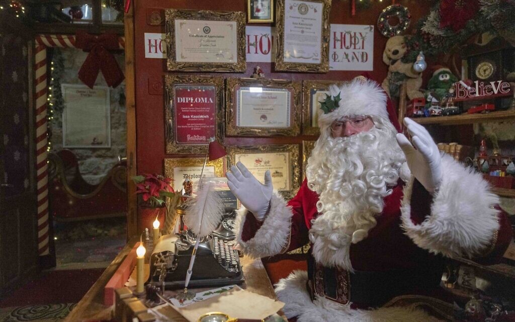 Issa Kassissieh, dressed as Santa Claus, poses for a photo at his home on Christmas eve in the Christian Quarter of the Old City of Jerusalem, December 24, 2025. (Chaim Goldberg/Flash90) Issa Kassissieh, dressed as Santa Claus, poses for a photo at his home on Christmas eve in the Christian Quarter of the Old City of Jerusalem, December 24, 2025. (Chaim Goldberg/Flash90)
