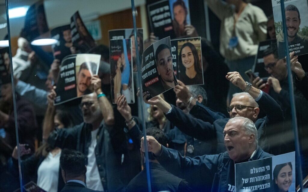 FILE: Bereaved families protest at the Knesset ahead of a vote on a politically-appointed probe of the October 7, 2023, attack, December 24, 2025. (Yonatan Sindel/Flash90) FILE: Bereaved families protest at the Knesset ahead of a vote on a politically-appointed probe of the October 7, 2023, attack, December 24, 2025. (Yonatan Sindel/Flash90)