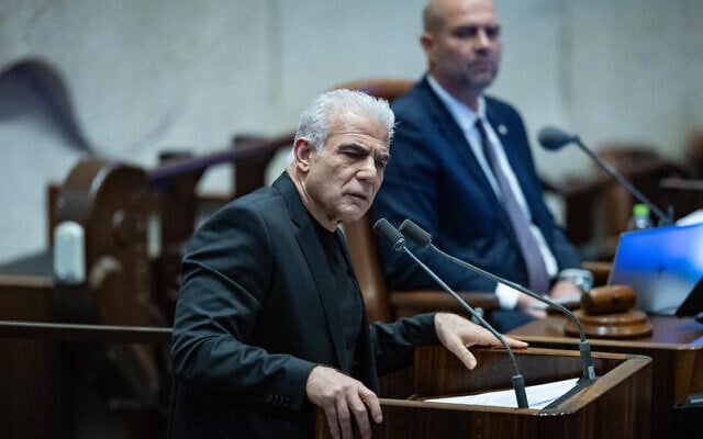MK Yair Lapid speaks at the Knesset on December 24, 2025. (Yonatan Sindel/Flash90)