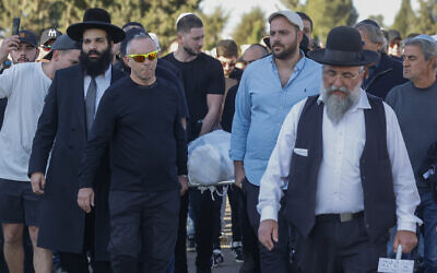 Friends and family attend the funeral of Dan Elkayam, who was murdered in a the Sydney Hanukkah terror attack, at a cemetery in Ashdod, December 25, 2025. (Tal Gal/Flash90)