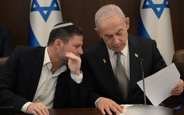 Prime Minister Benjamin Netanyahu (right) and Finance Minister Bezalel Smotrich talk at a meeting to approve the state budget, December 4, 2025. (Haim Zach/GPO)