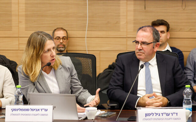 Deputy attorney generals Avital Sompolinsky (left) and Gil Limon (right) attend a meeting of the Knesset Foreign Affairs and Defense Committee, December 28, 2025. (Noam Moskowitz, Office of the Knesset Spokesperson)