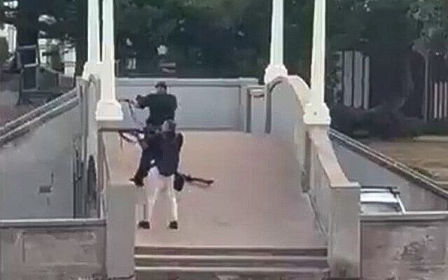 Sajid Akram, foreground, and Naveed Akram open fire in a terror attack on people at a Jewish event in Sydney, Australia, on December 14, 2025, in an image taken from a video posted online. (Screen capture: X) Sajid Akram, foreground, and Naveed Akram open fire in a terror attack on people at a Jewish event in Sydney, Australia, on December 14, 2025, in an image taken from a video posted online. (Screen capture: X)