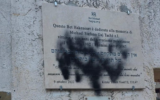 Black spray paint found Monday on the memorial plaque for Stefano Gaj Taché at the Beth Michael Synagogue, in Rome. (European Jewish Congress)