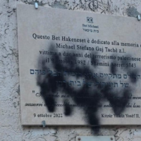 Black spray paint found Monday on the memorial plaque for Stefano Gaj Taché at the Beth Michael Synagogue, in Rome. (European Jewish Congress)