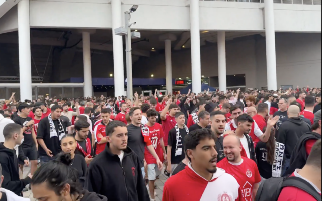 Fans of Hapoel Tel Aviv leave Bloomfield Stadium as they boycott a game due to supporters being barred from attending after wearing t-shirts describing the police, the outlawed extremist Kach party, and the Maccabi soccer club as "scum," on December 6, 2025. (Screenshot, X; used used in accordance with Clause 27a of the Copyright Law) Fans of Hapoel Tel Aviv leave Bloomfield Stadium as they boycott a game due to supporters being barred from attending after wearing t-shirts describing the police, the outlawed extremist Kach party, and the Maccabi soccer club as "scum," on December 6, 2025. (Screenshot, X; used used in accordance with Clause 27a of the Copyright Law)