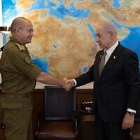 Prime Minister Benjamin Netanyahu (right) shakes hands with Maj. Gen. Roman Gofman, his military secretary, whom he nominated on December 4, 2025, to be the next director of the Mossad. (Prime Minister's Office Spokesperson)