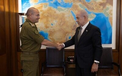 Prime Minister Benjamin Netanyahu (right) shakes hands with Maj. Gen. Roman Gofman, his military secretary, whom he nominated on December 4, 2025, to be the next director of the Mossad. (Prime Minister's Office Spokesperson)