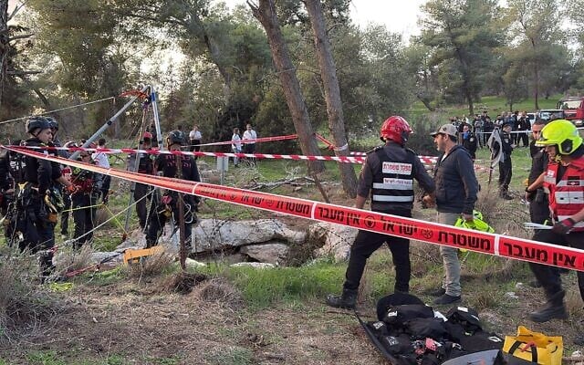 Firefighters extract a body from a pit near Kfar Zoharim, an ultra-Orthodox youth village, on December 9, 2025. (Fire and Rescue Service) Firefighters extract a body from a pit near Kfar Zoharim, an ultra-Orthodox youth village, on December 9, 2025. (Fire and Rescue Service)