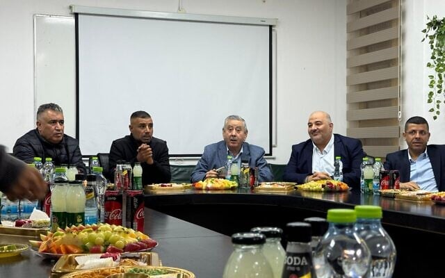 Ra'am chairman Mansour Abbas and MK Waleed Alhawashleh convene with heads of Bedouin locales in the Negev for an emergency meeting in opposition to police's practice of erecting roadblocks in Bedouin towns, in Tel Sheva on December 15, 2025. (Courtesy/Talal Alkernawi)