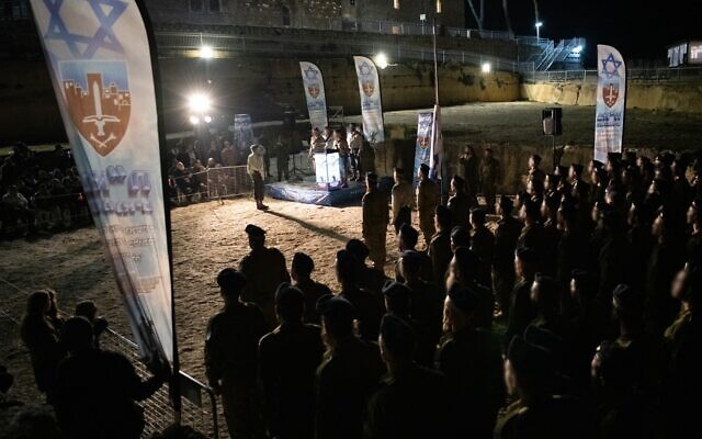 Ultra-Orthodox soldiers from the Hasmonean Brigade take part in a ceremony after completing a squad commanders' course, December 2, 2025. (Israel Defense Forces)