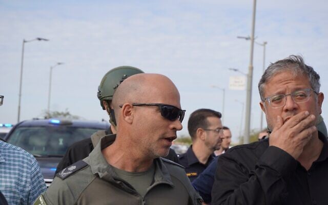 National Security Minister Itamar Ben Gvir (right) and Deputy Commissioner Nachshon Nagler (left), commander of the Border Police's National Guard force, tour the Bedouin town of Tarabin al-Sana during a police raid on December 31, 2025. (Charlie Summers/Times of Israel)