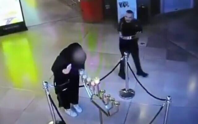 A woman is seen blowing out Hanukkah candles in a Tel Aviv mall in an undated video from December 2025. (Screen grab/ X, used in accordance with Clause 27a of the Copyright Law) A woman is seen blowing out Hanukkah candles in a Tel Aviv mall in an undated video from December 2025. (Screen grab/ X, used in accordance with Clause 27a of the Copyright Law)