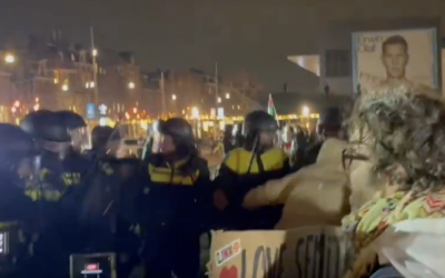 Police clash with protesters outside the Concertgebouw in Amsterdam during a series of Hanukkah-related events inside, some of which featured the official IDF cantor, Shai Abramson, December 14, 2025. (Screenshot via X, used in accordance with Clause 27a of the Copyright Law)