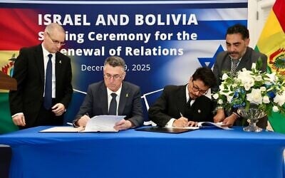 Foreign Minister Gideon Sa'ar (second from left) and his Bolivian counterpart Fernando Aramayo (second from right) sign an agreement renewing ties between their countries in Washington, DC, on December 9, 2025. (Shmulik Almani/Israeli Ministry of Foreign Affairs)